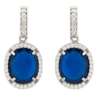 Silver oval drop earrings with blue round gemstone and white crystal halo