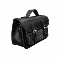 Black leather and tweed micro satchel, side view with double buckle closures and top handle