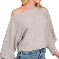 Grey knit boat-neck sweater with loose off-shoulder fit and balloon cuffs