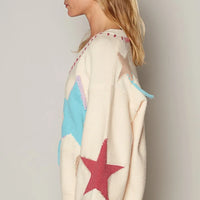 Pale beige V-neck long-sleeve sweater with blue and red star prints