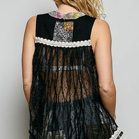 Black sheer floral tank with lace trim and patchwork panels, shown from the back