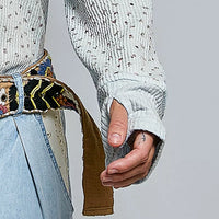Light blue speckled knit long sleeve with elastic cuff and textured ribbing