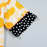 Printed lounge shorts with pumpkin motif and black polka-dot trim