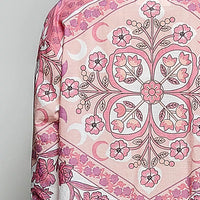 Floral button-down shirt back yoke close-up with pink floral medallion on ivory base