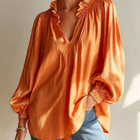 Tangerine ruffle-trim long-sleeve blouse with V-neck and gathered shoulder ruffles