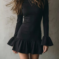 Black long-sleeve mini dress with ruffle hem and bell cuffs