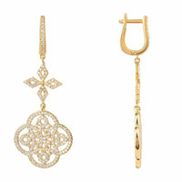 Gold Celtic knot clover drop earrings with pavé details, shown front and side