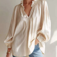 Beige ruffle-trim long-sleeve blouse with V-neck and frilled neckline