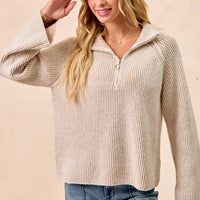 Two-tone rib knit zip-collar top, taupe and cream, standing side view