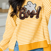 Gold and white striped long-sleeve top with sequin ghost “Boo!” and split hem