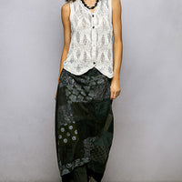 Off-white sleeveless V-neck sweater vest, front button details on textured knit