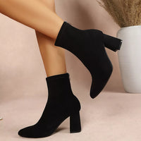 Black point-toe block-heel ankle boots with short cuff and chunky mid heel