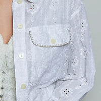 Off white eyelet textured button-front jacket detail with chest flap pocket and buttons