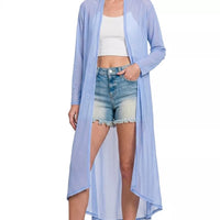 Light blue mesh open-front cardigan, asymmetrical hem over denim shorts