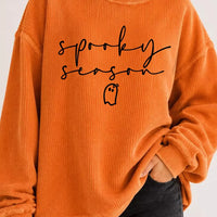Orange ribbed pullover sweatshirt featuring “sprooky season” text and ghost icon