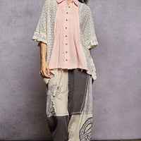 Womenโs baby pink button-front pleated shirt with lace crochet patch and ruffled hem