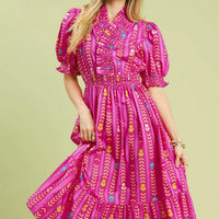 Pink patterned smocked midi dress with ruffle collar and puff sleeves