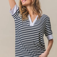 Contrast striped notched knit top, navy and ivory V-neck, short sleeves with contrast trim.