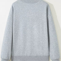 Gray long-sleeve sweatshirt back on hanger, plain design with crew neck