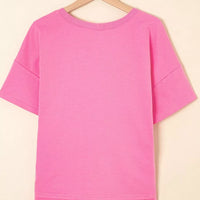 Fuchsia pink plain back short-sleeve tee and drawstring shorts set on hanger