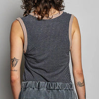 Ribbed V-neck sleeveless tank, dark charcoal, back view with gathered contrast hem