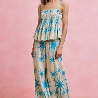 Blue palm tree smocked cami top with adjustable straps and tiered peplum ruffles