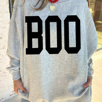 Light gray reversible mock-neck sweatshirt with large black “BOO” front graphic
