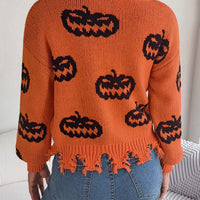 Back view orange pumpkin print sweater with fringed hem and long sleeves
