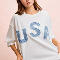 Ivory french terry pullover top with blue "USA" patch appliques and wide short sleeves