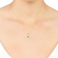 Gold-tone evil eye necklace with small blue eye pendant on a fine chain