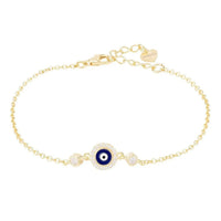 Gold evil-eye enamel bracelet with dark blue eye center and small clear accents