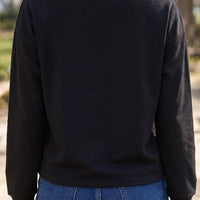 Black long sleeve sweatshirt back view, plain round neckline and cuffs