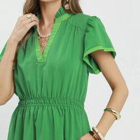 Kelly green V-neck midi dress close-up with smocked waist and flutter sleeves