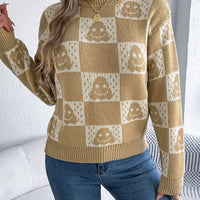 Beige and cream checkerboard knit sweater with jack-o-lantern face motifs, long sleeve