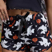 Cami and shorts set: ghost-and-pumpkin print shorts with black elastic waist, lettuce edge