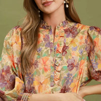 Floral print mini dress close-up: button placket, gathered neckline, smocked cuffs