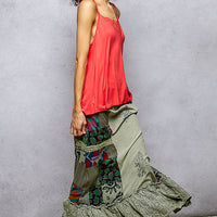 Patchwork ruffled skirt in sage with multicolor print panel and embroidered hem