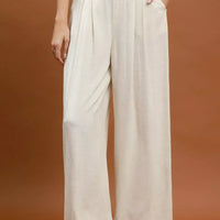 Cream linen-blend wide-leg trousers with high waist and pleated front