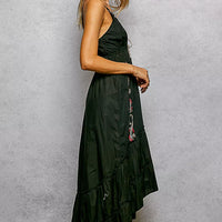 Black embroidered cami midi dress, side view with tassel tie detail