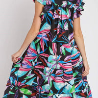 Plus size midi dress back view with ruffled sleeves and tiered skirt, leaf print.