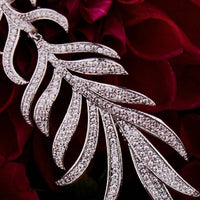 Silver feathered leaf drop earring with pavΓ© stones