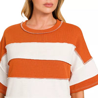 Burnt orange and white striped terry top with crew neck and contrast trim