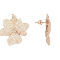 Large flower stud earrings in rose-gold tone, side view with butterfly backing