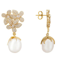Gold floral pearl earrings with white drop and butterfly back, side view