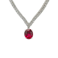 Silver tennis necklace with oval ruby gemstone drop on a rhinestone chain