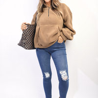 Light blue high-waisted skinny jeggings with ripped knee panels and distressed wear