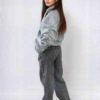 Oversized gray hoodie with ruched sleeves, pouch pocket, and drawstring hood