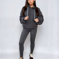 Dark gray oversized hoodie with drawstring hood and front pouch pocket, ruched sleeves