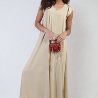 Beige wide-leg jumpsuit with V-neck and ruffle sleeves, long draped waist