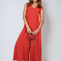 Red wide-leg jumpsuit with V-neck and ruffle sleeves, relaxed draped fit